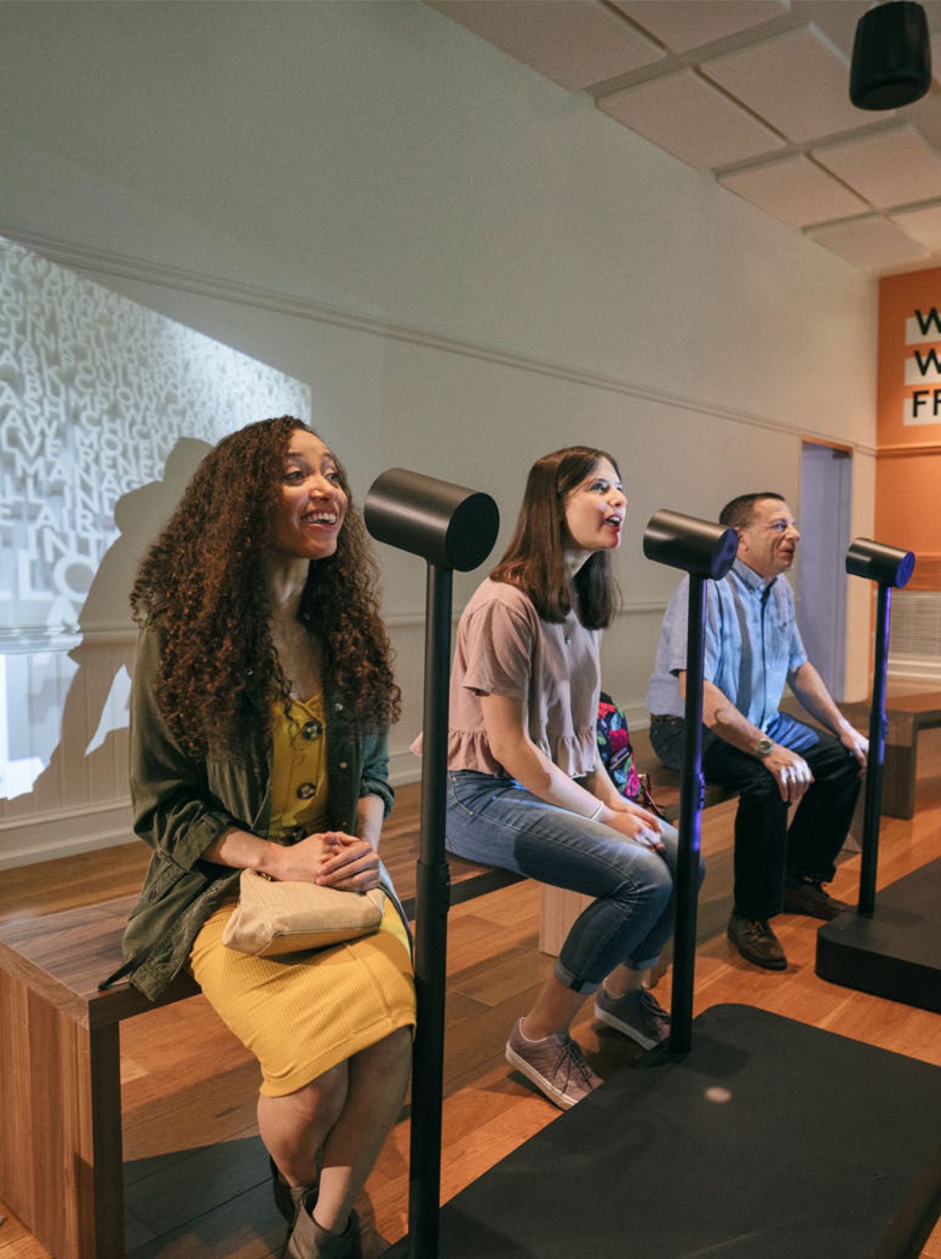 Voice-activated exhibits include “Where Do Words Come From,” a 22-foot-tall talking word wall, an acoustically-sealed room where visitors use a teleprompter to deliver their own versions of historic speeches and a karaoke lounge. (Courtesy DuHon Photography/Long Story Short Media)