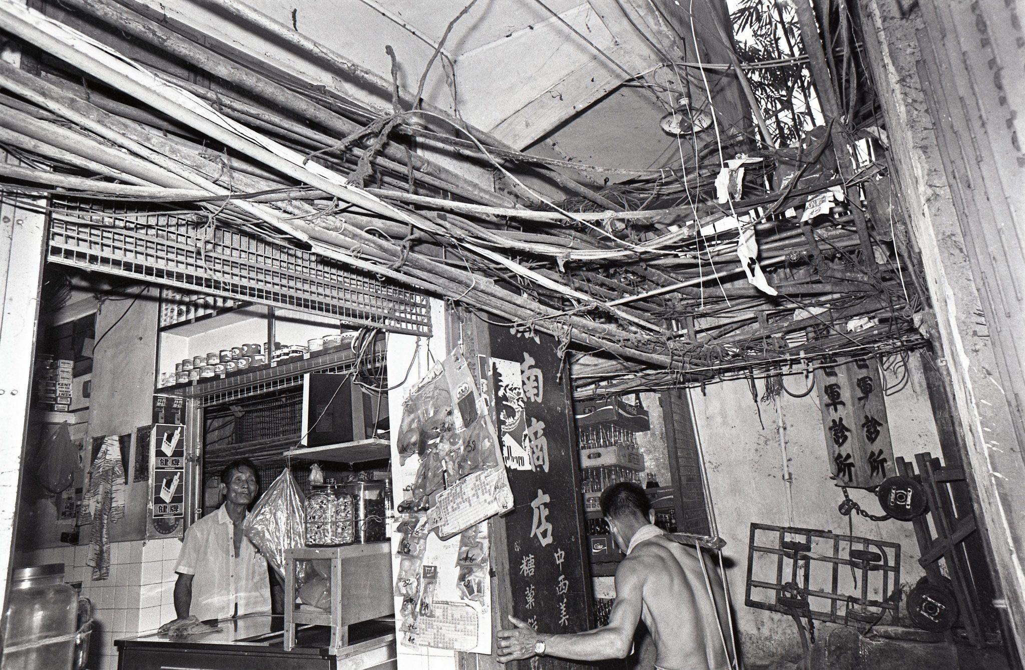 Illegal water pipes at the Kowloon Walled City. 06OCT77 SCMP/C. Y. Yu